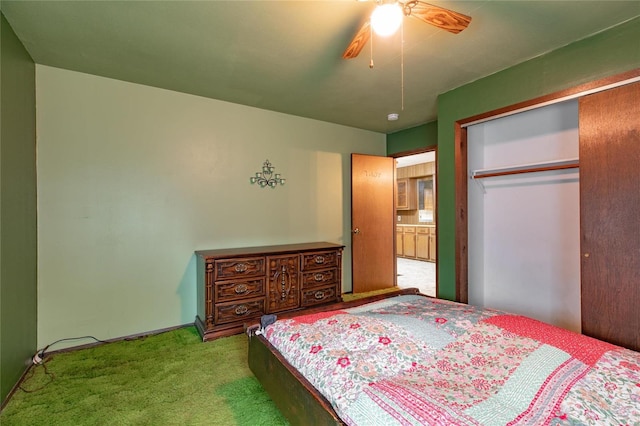 carpeted bedroom with a closet and ceiling fan