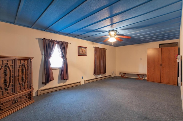 carpeted spare room with baseboard heating, ceiling fan, and a textured ceiling