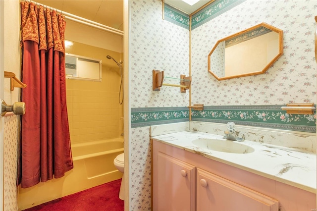 full bathroom featuring vanity, shower / bath combination with curtain, and toilet