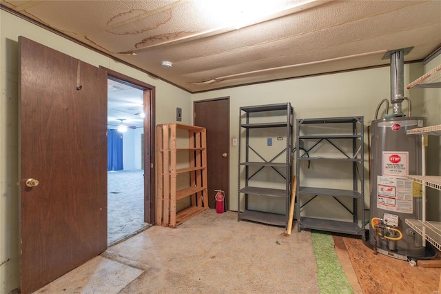 basement featuring a textured ceiling, ceiling fan, gas water heater, and light carpet