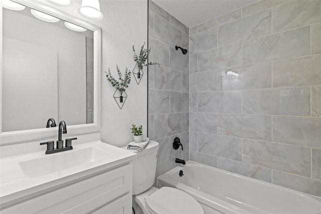 full bathroom featuring vanity, toilet, and tiled shower / bath combo