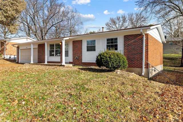 ranch-style house with a garage and a front lawn