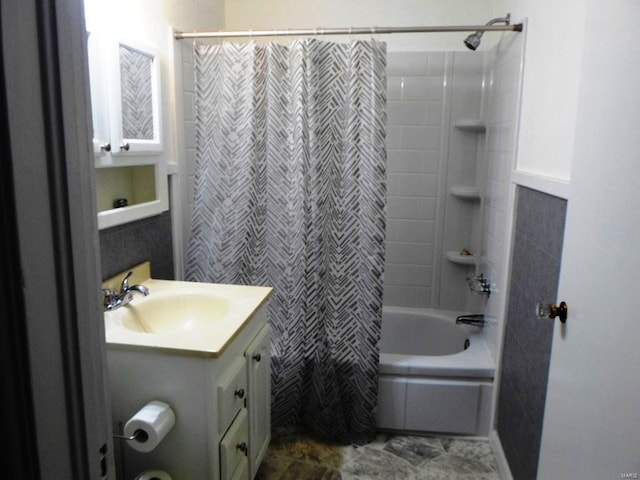 bathroom featuring vanity and shower / bath combo