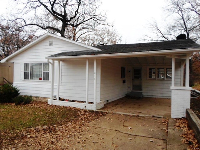 exterior space with a carport