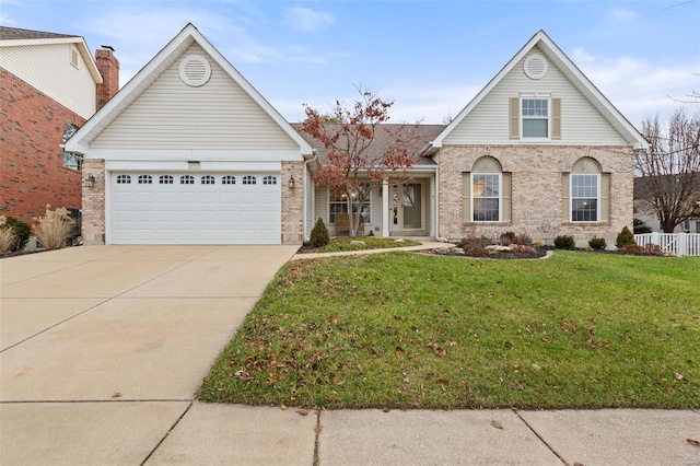 view of front property featuring a garage and a front yard