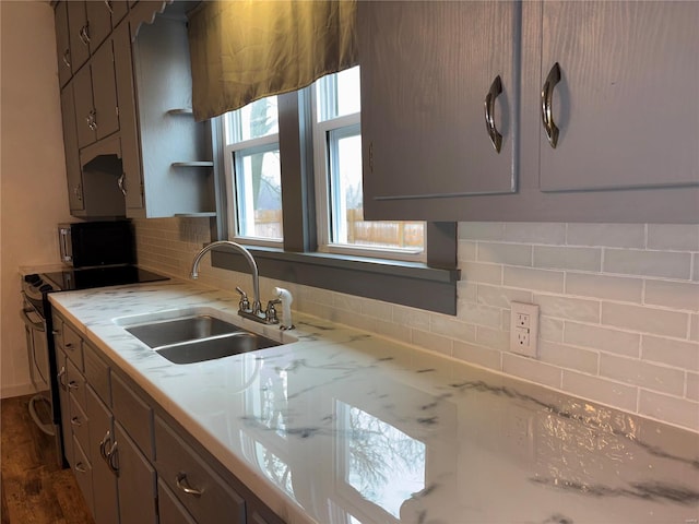 kitchen featuring sink, dark wood-type flooring, backsplash, and electric stove