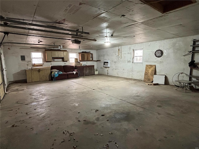 garage featuring a garage door opener and heating unit