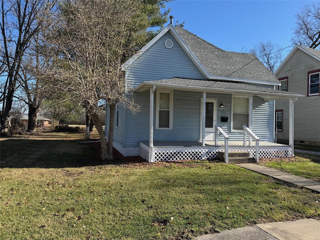 bungalow-style home with a porch and a front lawn