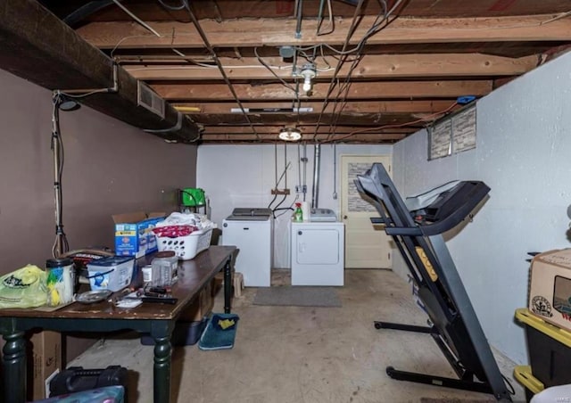 basement with washing machine and clothes dryer