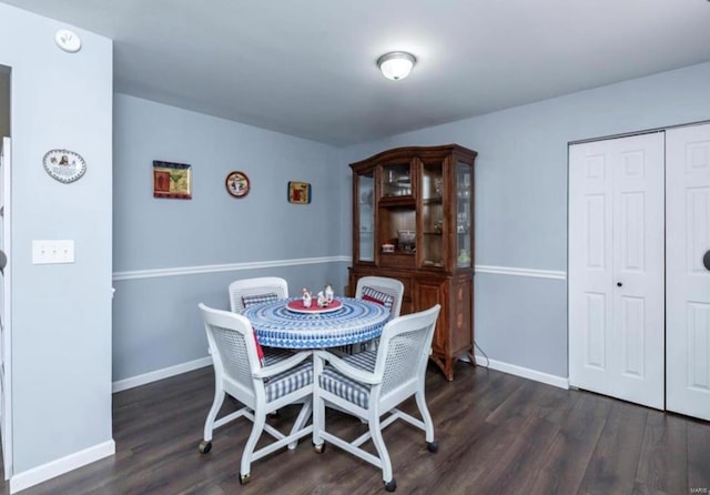 dining room with dark hardwood / wood-style floors