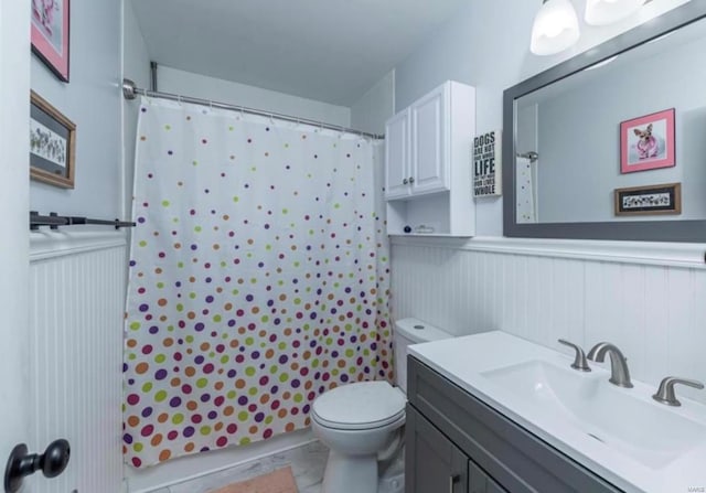 bathroom with curtained shower, tile patterned flooring, vanity, and toilet