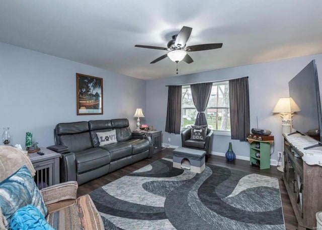 living room with ceiling fan and dark hardwood / wood-style floors