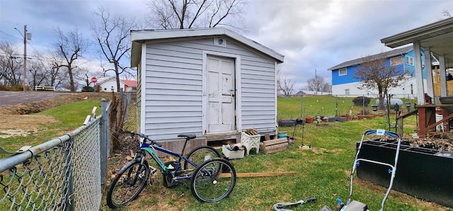 view of outbuilding with a lawn