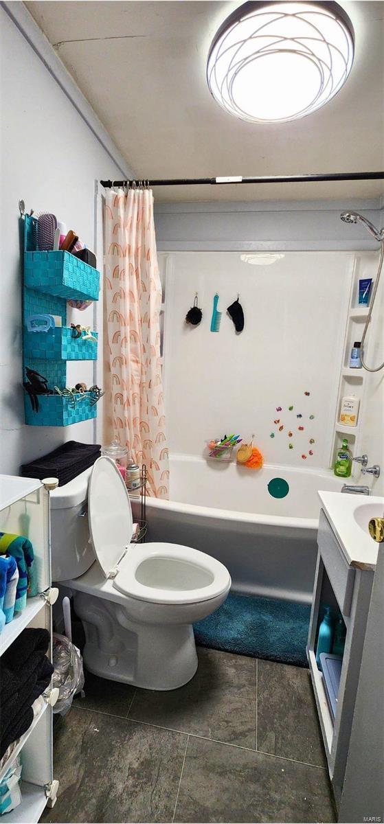 full bathroom featuring vanity, toilet, and shower / bath combo with shower curtain