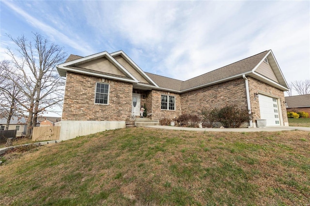 view of front of house featuring a garage and a front yard