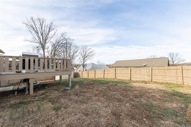 view of yard with a wooden deck