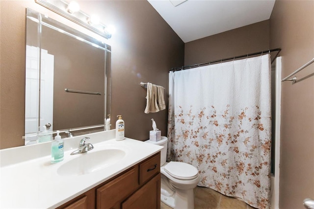 bathroom with tile patterned floors, vanity, and toilet