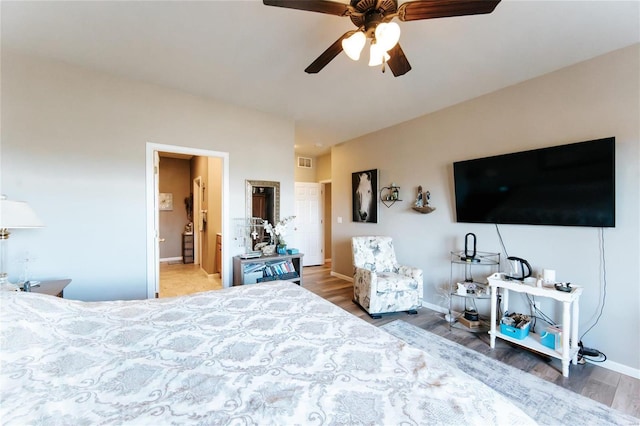 bedroom with hardwood / wood-style flooring and ceiling fan