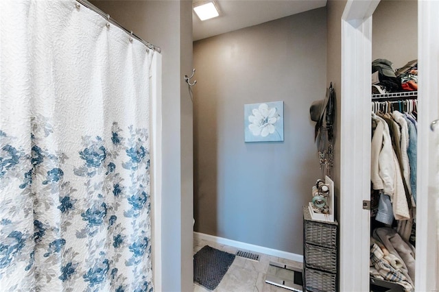 bathroom with tile patterned flooring