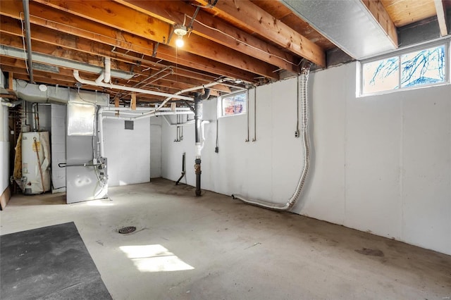 basement with gas water heater and heating unit