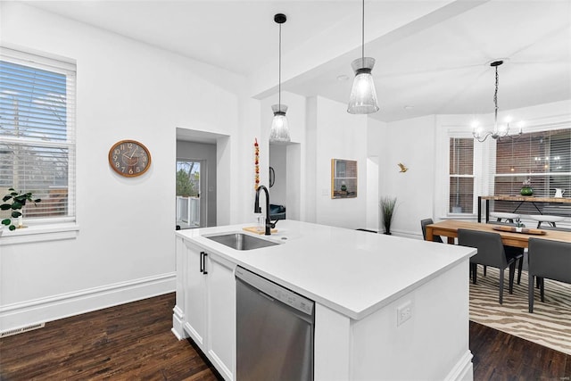 kitchen with sink, white cabinetry, decorative light fixtures, a center island with sink, and stainless steel dishwasher