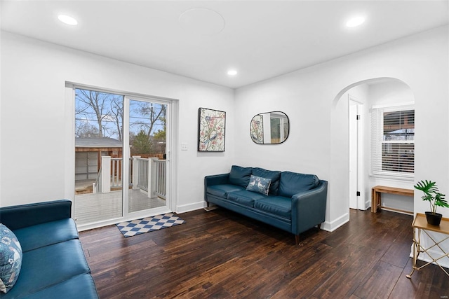 living room with dark hardwood / wood-style flooring