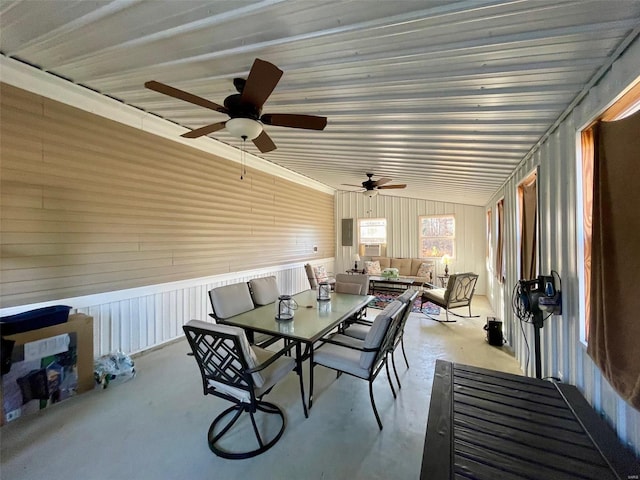 sunroom with ceiling fan and lofted ceiling