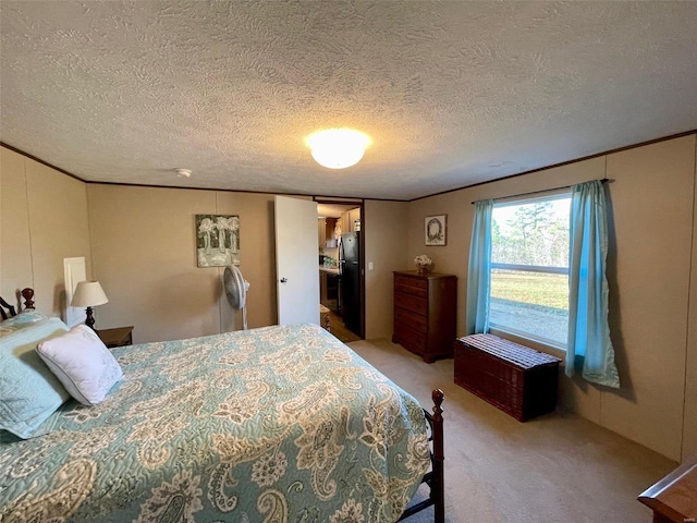 carpeted bedroom with black fridge and a textured ceiling