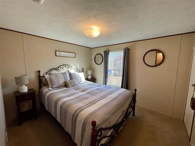 carpeted bedroom featuring a textured ceiling