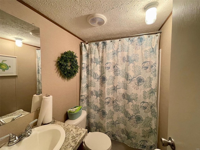 bathroom with vanity, a shower with curtain, crown molding, toilet, and a textured ceiling