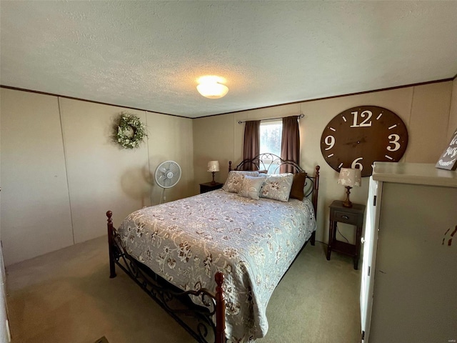 carpeted bedroom with a textured ceiling