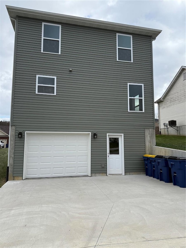 back of house with a garage