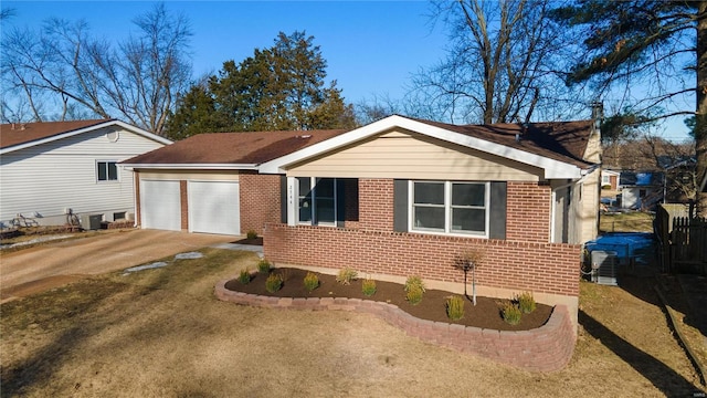 ranch-style house with a garage and a front yard