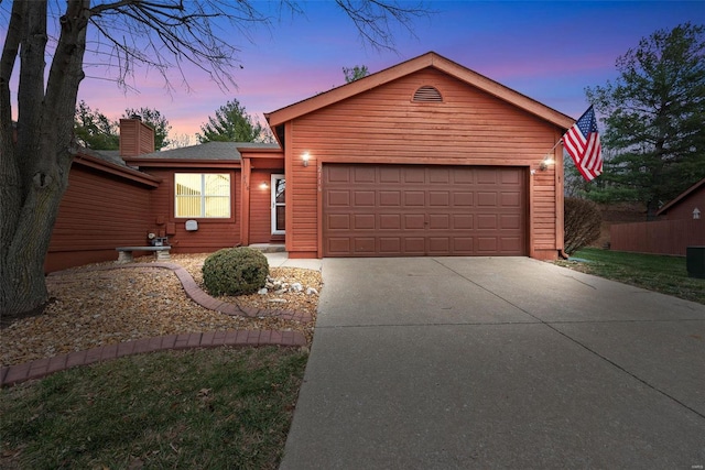 single story home featuring a garage