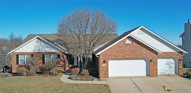 view of front facade with a garage and a front lawn