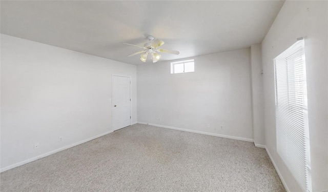 empty room with carpet floors and ceiling fan