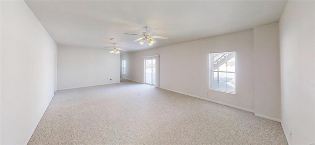 carpeted empty room with ceiling fan