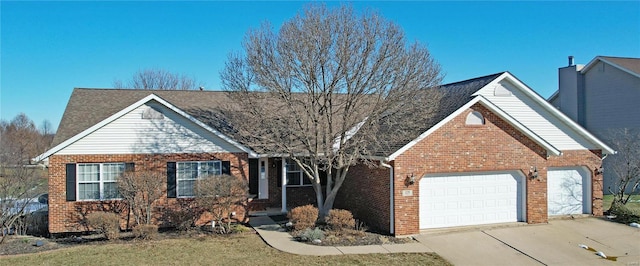 view of front of property with a garage and a front yard