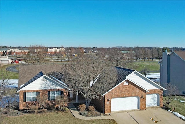 view of front facade with a garage and a front lawn