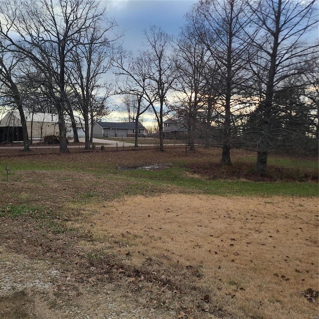 view of yard at dusk