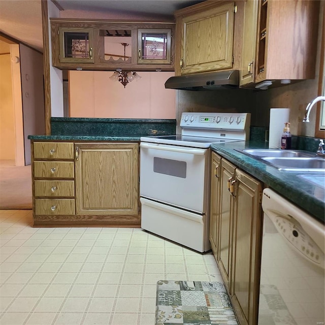 kitchen with white appliances and sink