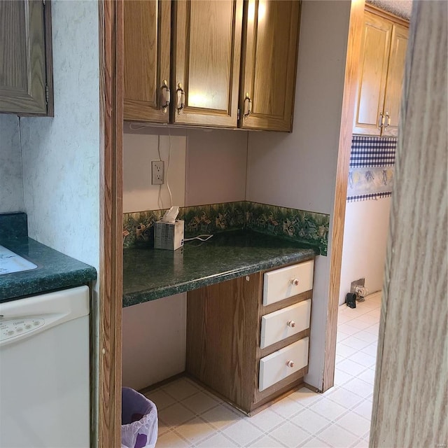 kitchen featuring dishwasher and light tile patterned floors