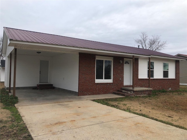 ranch-style house with a carport