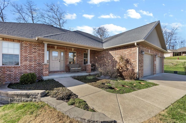 single story home featuring a porch and a garage