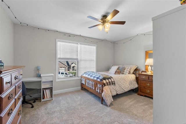 bedroom featuring ceiling fan and light colored carpet