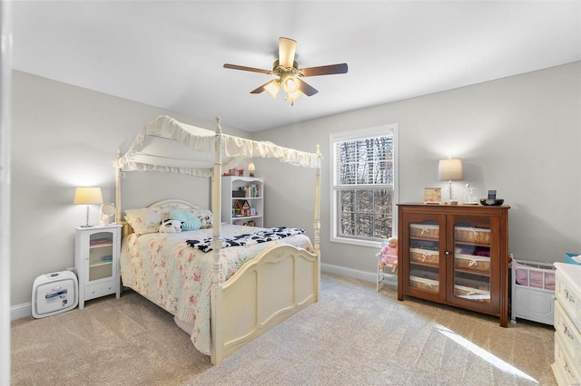 bedroom featuring light carpet and ceiling fan