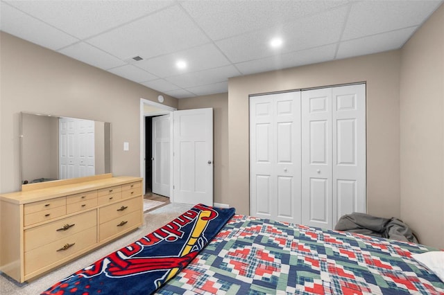 bedroom with a paneled ceiling