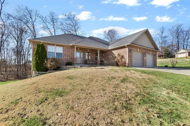 ranch-style house featuring a garage and a front yard