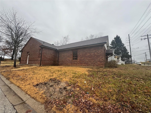 view of property exterior with a lawn