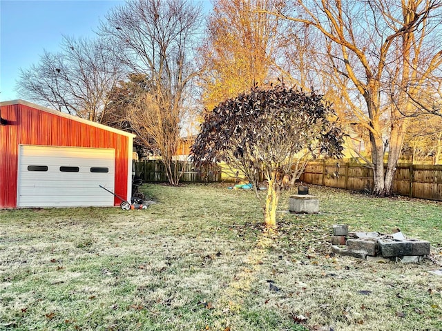 view of yard featuring a garage and an outdoor structure